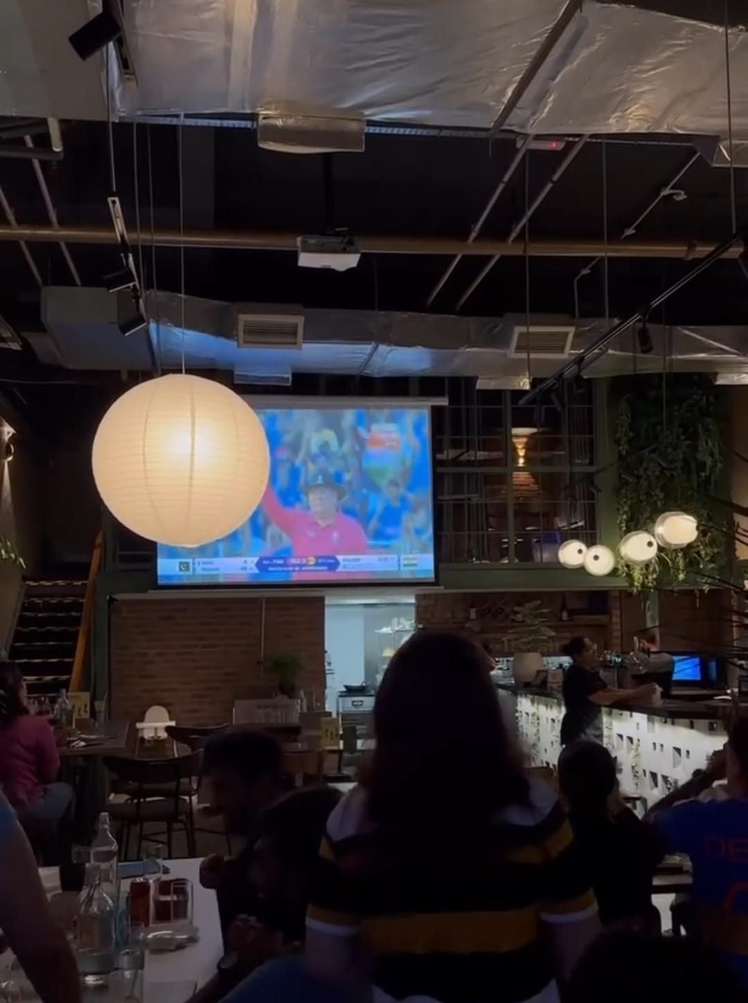 Guests watching a live sports screening at Muska KL